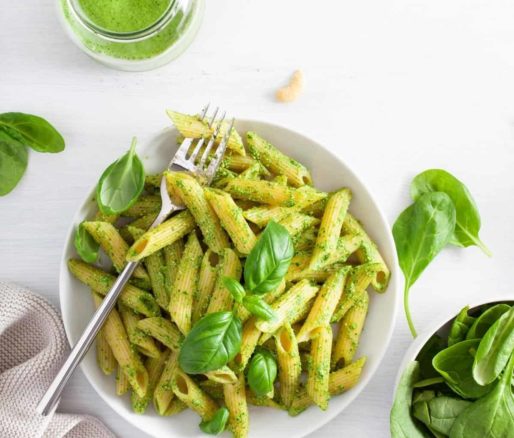 Pasta with vibrant green sauce: a fresh and flavorful dish bursting with herbs and natural goodness.