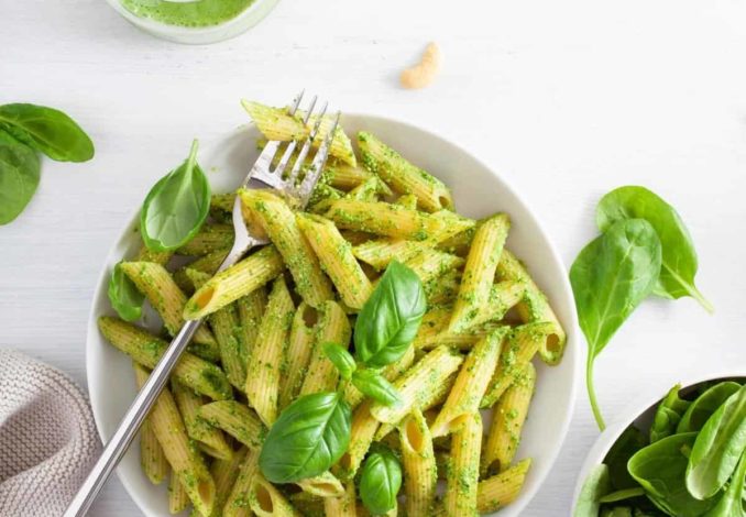 Pasta with vibrant green sauce: a fresh and flavorful dish bursting with herbs and natural goodness.