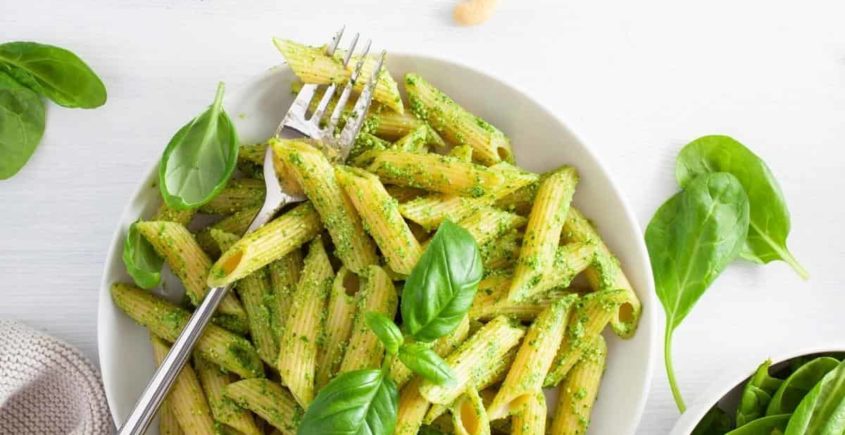 Pasta with vibrant green sauce: a fresh and flavorful dish bursting with herbs and natural goodness.