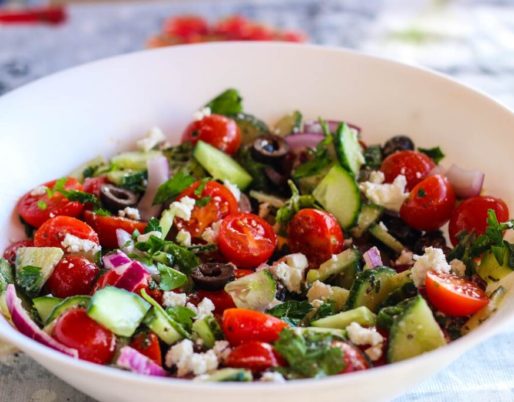 Delicious breakfast salad with olives and cheese, packed with fresh vegetables and a tangy vinaigrette dressing.