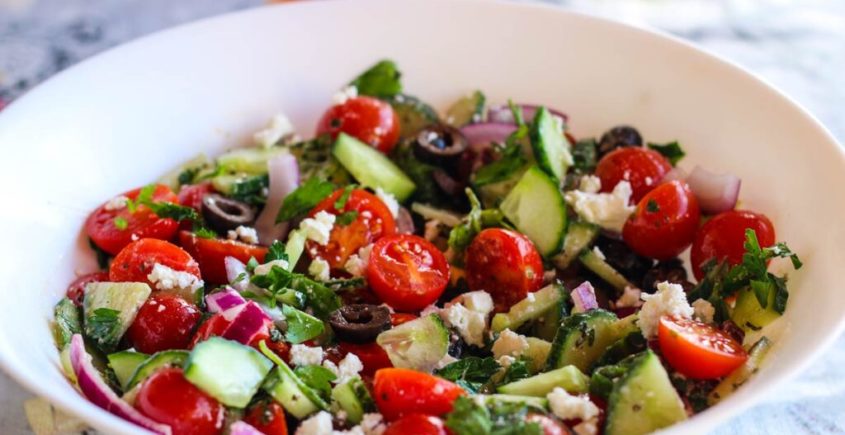 Delicious breakfast salad with olives and cheese, packed with fresh vegetables and a tangy vinaigrette dressing.