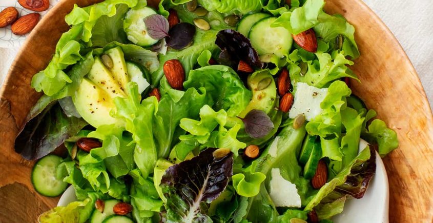 Refreshing green salad: a vibrant and healthy mix of crisp greens, colorful vegetables, and tangy dressing.
