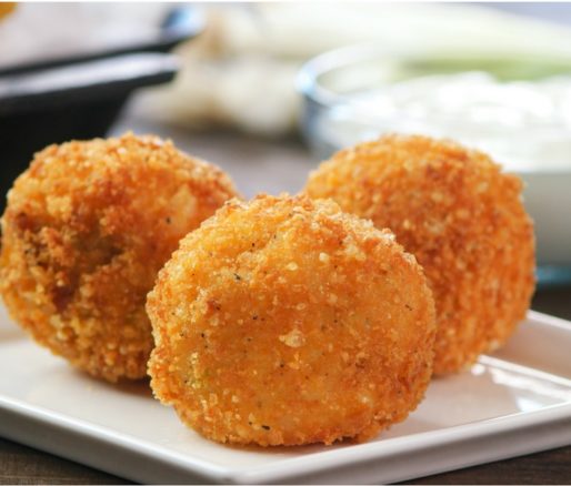 Crispy potato balls with a golden exterior, cooked to perfection using olive oil.
