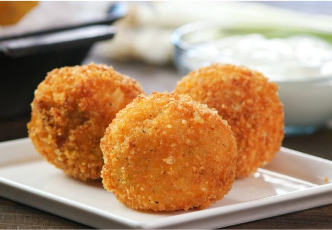 Crispy potato balls with a golden exterior, cooked to perfection using olive oil.