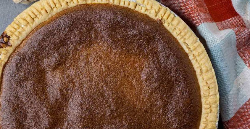 Scrumptious brown pie with a golden crust, filled with a rich and flavorful combination of ingredients.